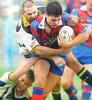 Timana Tahu leaving Cowboy defenders in his wake.