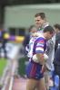 Matthew Johns walks off, disapointed with the loss.