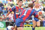 Adam MacDougall gets a pass away for Andrew Johns.