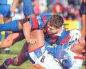 Mark Hughes tackles Francis Meli.