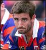 Andrew Johns watches on from the sidelines.