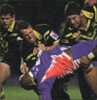 Matthew Gidley watches Scott Hill and Bryan Fletcher makes a tackle.