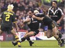 Adam MacDougall is all over Tonie Carroll in defence - Mat Rogers and Nigel Vagana watch on.