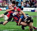 Ben Kennedy meets some strong defence.