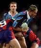 Jason Stevens is smashed by the Knights.