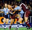 Mark Hughes is tackled.