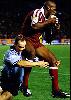 Adam MacDougall tackles Wendell Sailor.