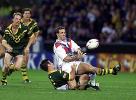 Paul Johnson is chopped down by Andrew Johns.