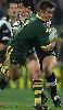 Andrew Johns is tackled by Ruben Wiki ...