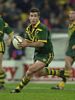 Andrew Johns about to throw a pass.