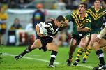 Andrew Johns about to take down Henry Paul.