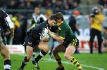 Matthew Gidley tackles Henry Paul.