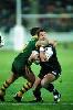Andrew Johns makes a highish tackle ...