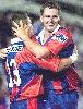 Mark Hughes celebrates one of his two tries.