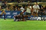 Justin Hodges crosses for a try.