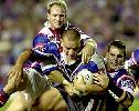Adam MacDougall tackles Shontayne Hape.