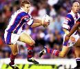 Sean Rudder about to lay on a try.