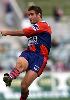 Andrew Johns kicks the match winning penalty, after Brett Finch's terrible blunder.