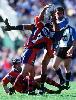 Andrew Johns tackles Chris McKenna.