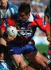 Andrew Johns getting tackled.