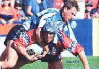 Justin Ryder (now with headgear!) is tackled.