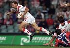 Jamie Ainscough breaks a tackle.