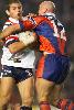 Ben Kennedy tackles Bryan Fletcher.