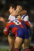 Ian Rubin is tackled by Glenn Grief and Matt Parsons.