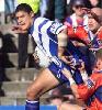 Willie Mason nearly breaks a tackle.