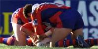 Robbie O'Davis and Darren Albert try to resuscitate the ball.