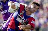 Andrew Johns is wrestled down.