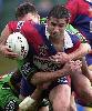 Andrew Johns can't bust a tackle for once.