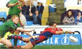 Robbie O'Davis chases a kick ...