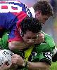 Sione Faumuina is tackled.