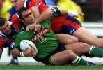 Anthony Colella is tackled by Steve Simpson and Matt Parsons.