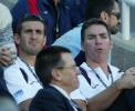 Andrew Johns and Michael Hagan look on from the stands.