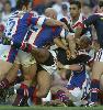 Andrew Lomu is thumped by strong Knights defence.
