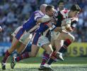 Ben Kennedy and Bill Peden try to stop Chris Flannery.