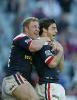 Damn Roosters celebrate a try.