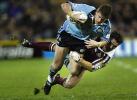 Matthew Gidley is back in the side but gets tackled.