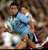 Andrew Johns makes a bust.
