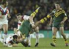 Danny Buderus watches as some Australian player is tackled.