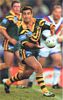Andrew Johns spins a pass along the backline.