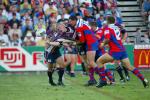 Steve Simpson tackles Nathan Long who offloads.