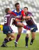 Andrew Johns puts in a kick.