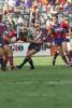 A Knights player (Josh Perry?) palms off Jason Ferris.