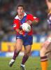 Andrew Johns spins it wide.