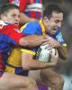Adam Mogg is tackled.