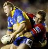 Daniel Abraham tackling Brad Drew in strange style.