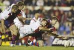 Jason Hooper can't stop Matthew Gidley scoring.